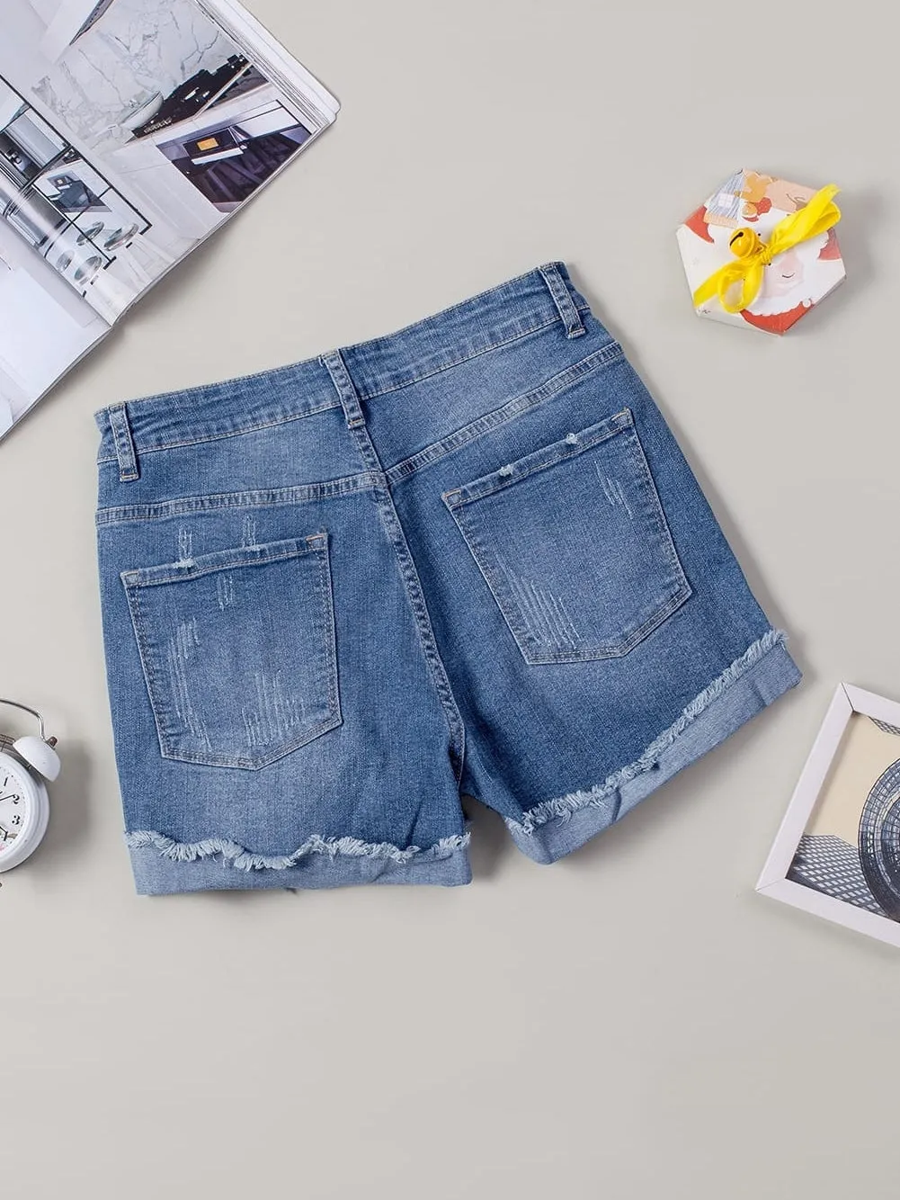 Bohemian Style Ripped Denim Shorts with Floral Accents